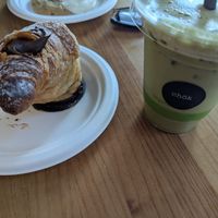 Chocolate cruffin and iced matcha latte with oat milk at Chök in 