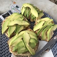 Bread with hummus and avocado  at Panonia Coffee in Granada