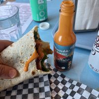 Ranch wrap with bumble bloom Buffalo sauce   at Maynard in Montreal