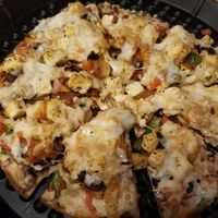 Veggie pizza with tofu, soy chorizo, and vegan cheese at One World in Peoria