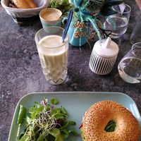 Matcha latte with oat milk, and avocado bagel with side salad at anything but coffee in Mainz