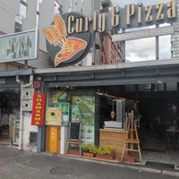 Photo from the street at Curly & Pizza in Quito