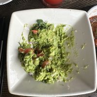 Over priced guac they dumped cheese on the scraped off   at Cantina Laredo in Virginia Beach
