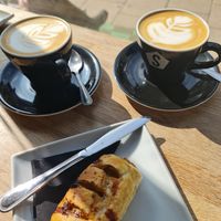 Oat lattes and vegan sausage roll at Strangers Coffee House in Norwich
