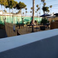 Outdoor parking lot conversation for virus season. at The Plot in Oceanside