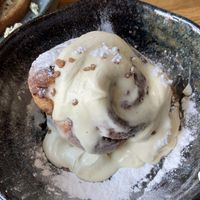 Vegan cinnamon roll with cream  at FACTORY GIRL Restaurant. in Amsterdam