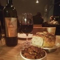 Wine, focaccia and roasted pecans at Gloriosa  in Glasgow