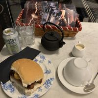 Vegan sausage and hash brown roll, Earl Grey tea with oat milk  at Gordon Street Coffee in Glasgow