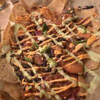 The half load of vegan nachos with chik‘un my favorite   at Dead Bird Brewing in Milwaukee