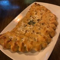 Garlic calzone with vegan cheese  at Stone & Brew in Highgate Hill