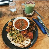 Delicious full vegan breakfast with a matcha and ginger latte made with coconut milk.  at The Chakra Lounge in Buxton