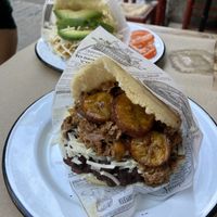 Arepa with Heura ‘chicken’ (back) and seitan, black beans and plantain (front)  at Tumatey in Barcelona