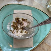 White pudding 🍮 with pomegranate & rose syrup, plus crispy pistachios. Delightful! Like a vegan panna cotta   at Beryl's  in Deventer