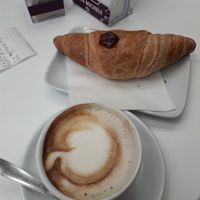 Soy cappuccino and vegan croissant with jam at San Michele Sud Experience in Padua