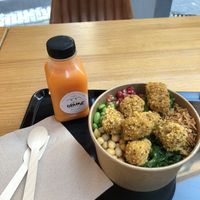 Individual bowl: brown rice, vegan nuggets, chickpeas, edamame, seaweed, greens, pomegranate  at Mahalo Poke in Alicante