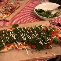 Divine pesto on pizza in the foreground. Nice insalata half eaten in bowl. “Vegetariana” vegan pizza in background.  All vegan cheese bought in.   #Veganuary at Trevi's in Amsterdam