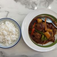 Mamak chicken entree- sweet and mild spicy deep-fried vegan chicken, bell peppers, and pineapple. Served with a side of white rice    at Mamak Vegan Kitchen in Chamblee