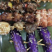 BBQ skewers - skewered yuba, two types of seitan, trumpet mushroom caps, eggplant and enoki mushroom wrapped inside smoky veggie ham  at Míng Xiāng Yuán 名湘園蔬食燒烤 in Tainan