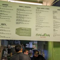 Indoor menu board at Evolution Fast Food in San Diego