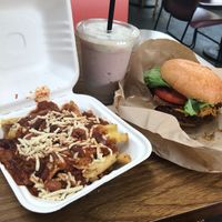 Bacon cheeseburger with chili’s cheese fries and a shake at Evolution Fast Food in San Diego