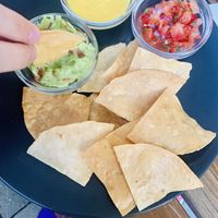 nachos with guacamole, vegan cheese sauce and tomato bits  at Pilgrim in Brno