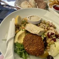 Vegan plate: bulgur, salad, falafel, legumes, tofu, hummus, olives...  at Naschmarkt in Vienna