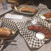 A feast! Wings, chili, Steak Bomb and Madison Philly sandwiches at The Green Owl Cafe in Madison