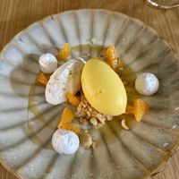 Sixth course: hazelnut mousse, mandarin parts, macadamia nuts and caramel  at Kale & de Bril in Goes