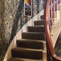 Staircase behind front door. William Morris wallpaper at Black Sheep Inn in Hammondsport