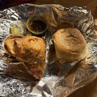 This is 1 of their HUGE Samosa’s (it comes with 2) & super yummy Vada Pav ( I ate half then took the pic😉. Def recommend   at Veggie Planet in Vaughan