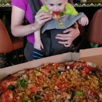 Enjoying vegan pizza!  at Rampart Treehouse in New Orleans