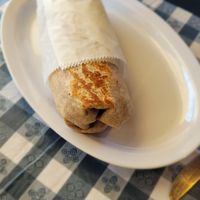 Breakfast Burrito
$13.00
Your choice of: seitan chorizo, seitan bacon, tempeh, or apple-fennel sausage with tofu-cauliflower cheesy scramble, homefries, spinach, tomato, salsa ve at The Wild Cow in Nashville