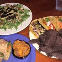 Caesar salad, Taco sampler with hummus and chips, chickpea salad wrap with mashed sweet potatoes at The Wild Cow in Nashville