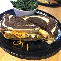 Ruben! Love the tanginess of the sauerkraut mixed with the sweetness of the grated carrots. Kale could’ve been braised/ steamed for a few minutes longer as it was chewy. at The Wild Cow in Nashville