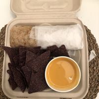 Chipotle & black bean burrito with a side of chips and queso! at The Wild Cow in Nashville