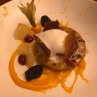 Pineapple with coconut ice cream, mango puree, berries, caramel and pink peppercorns  at The Angel Inn in Colchester
