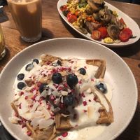 Ice coffee, queen waffle, and scrambled tofu toast at Flavour Bastards in Copenhagen