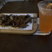 Vegan veggie pizza and aperol ginger lemon drink  at Justo 741 in Porto Alegre