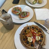 Hummus wrap, lox bagel, waffle, iced soy mocha latte  at Olena Cafe in Honolulu