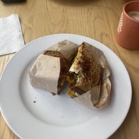 Breakfast sandwich with soy latte and Mac nut milk  at Olena Cafe in Honolulu