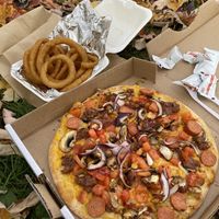 Pizza and onion rings   at Atlas Pizza in Montreal