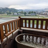 Private bath attached to room with river view at Ryokan Ayunosato in Hitoyoshi