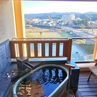Private outdoor hot spring overlooking Kuma river. at Ryokan Ayunosato in Hitoyoshi