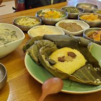 Perilla seed stew and lotus leaf rice, with all the sides that are included. at Puleunsolmalg Eunhyang 푸른솔맑은향 in Jeju