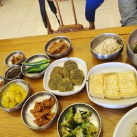 Banchan including pancakes and tofu at Puleunsolmalg Eunhyang 푸른솔맑은향 in Jeju