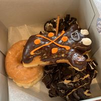 Vegan glazed, dirt, dirty old bastard, and voodoo doll  at Voodoo Doughnut - Washington Ave in Houston