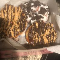 2 “Old Dirty Bastards Doughnut” , 1 “Dirt” Doughnut, & 1 “VooDoo Doll Doughnut (underneath)”  at Voodoo Doughnut - Washington Ave in Houston