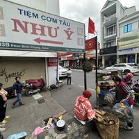 The sign the seller is next to.  at Banh Mi Chay Co Hoa in Da Lat