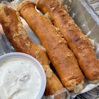 Cheesy breadsticks with a side of ranch  at Cruzer Pizza in Los Angeles