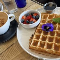 Vegan waffle with berries on the side, and a hot chai  at Met Her At A Bar in Los Angeles